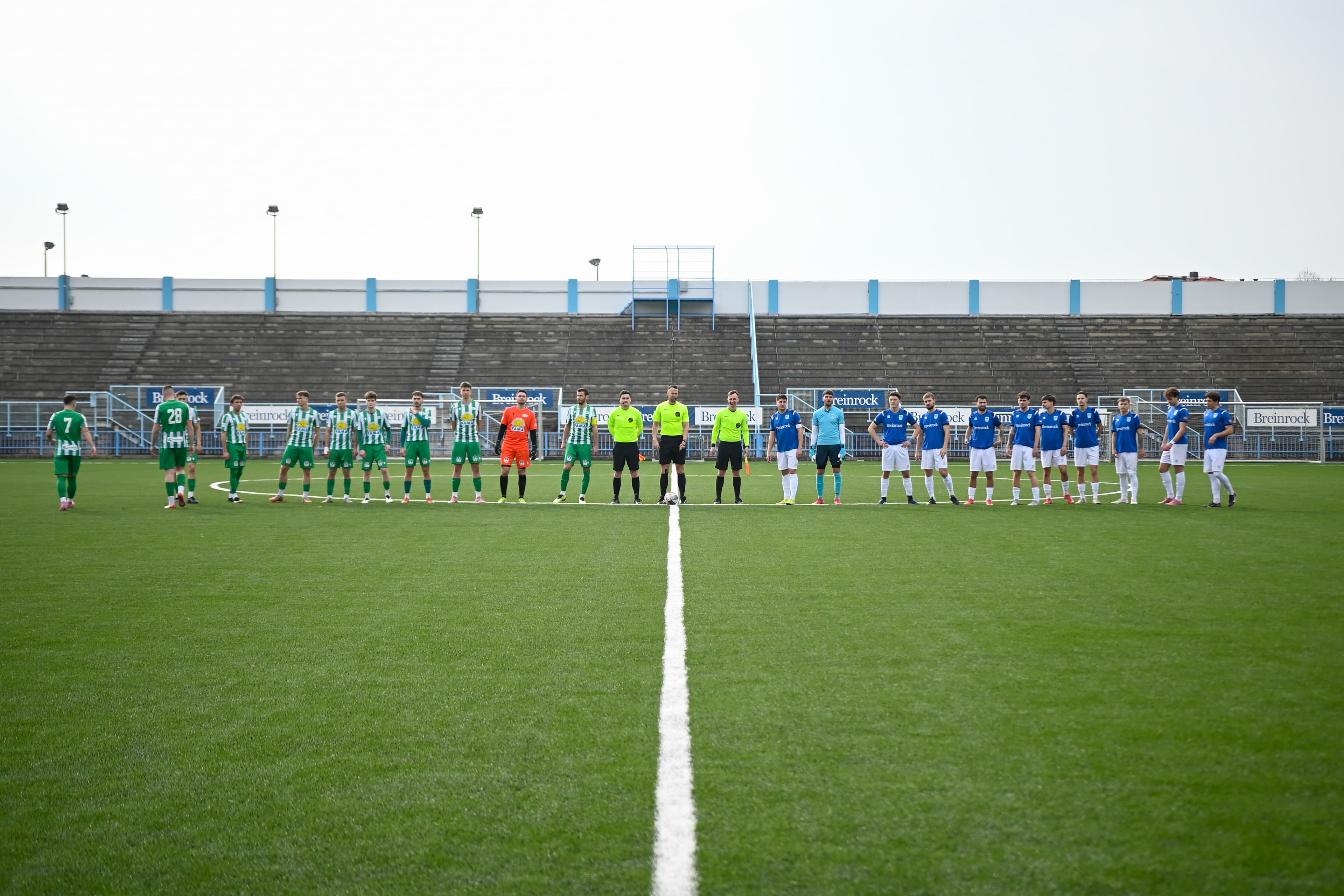 NK Izola and the visiting side lined up at the centre circle before kickoff at Stadion Drvarski